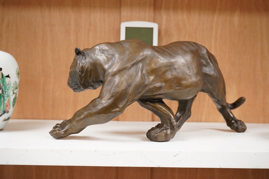 After Salvatore Melani (1902-1934), contemporary patinated bronze of a tiger, 39cm wide